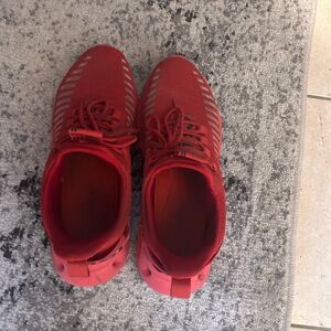 Used red running shoes